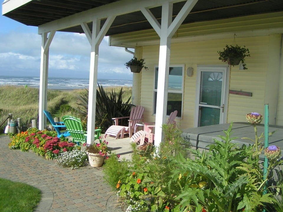 Entrance to the Beach Bum Inn. Showing covered patio, hot tub, seating area.