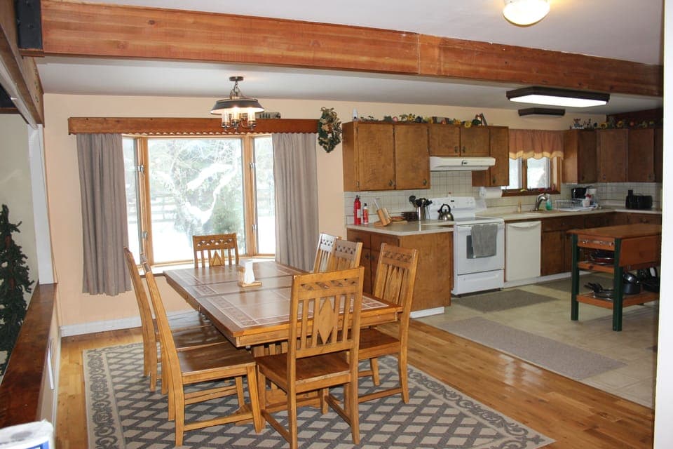 Part of the kitchen and a second dining table, which overlooks living room table
