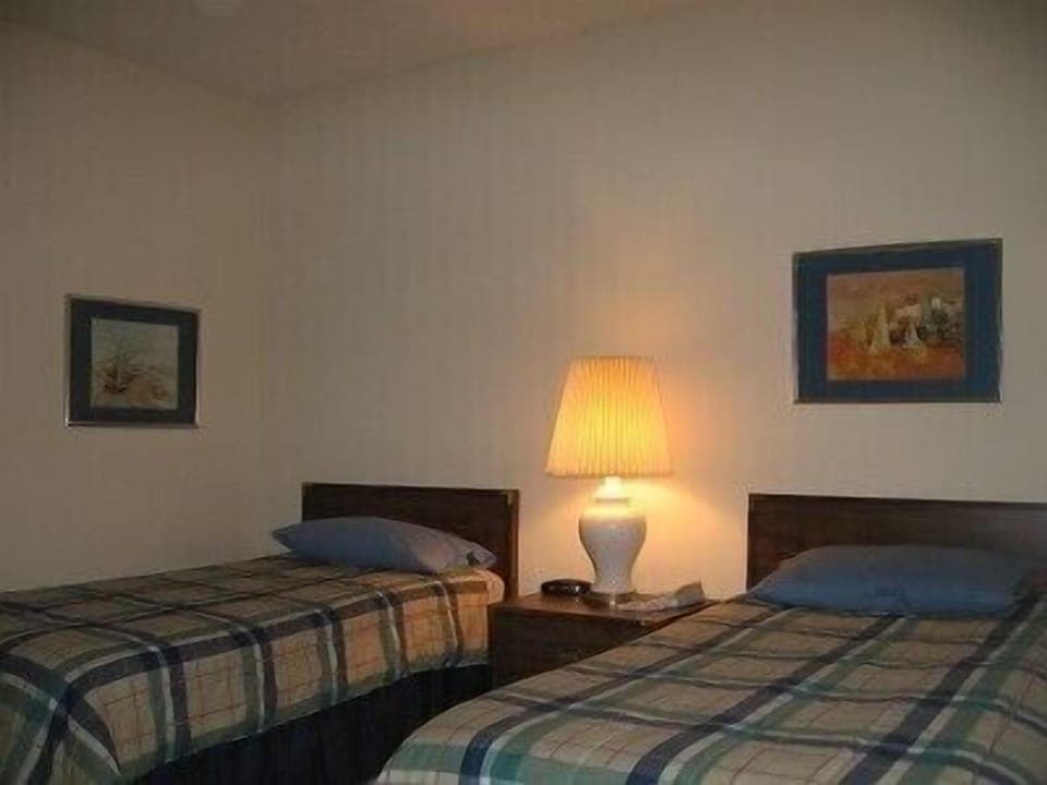 Guest bedroom is set up with twin beds which can be combined to make a king-bed.