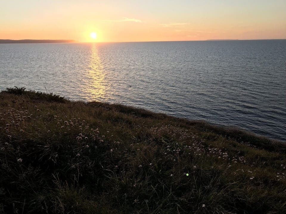 Watching the sun set over Hartland Point from Abbotsham Cliffs 