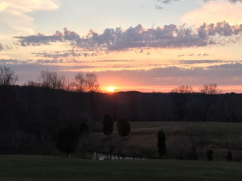 Watch the sun rise from the porch swing, rocking chairs or table