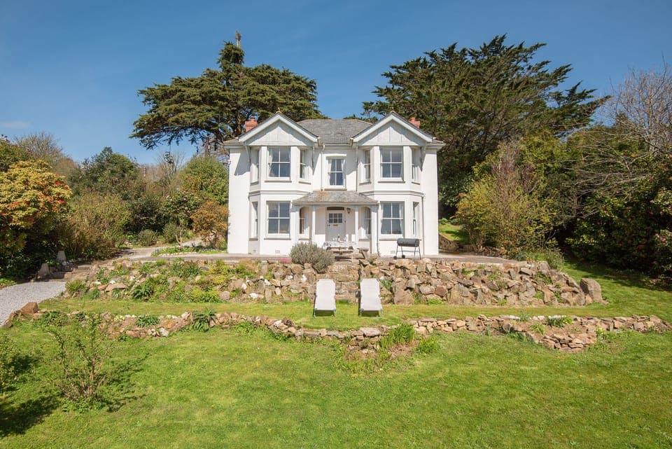 The house surrounded by gardens