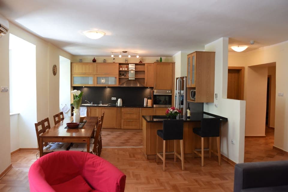 From livingroom towards kitchen and hall (hall to the right)