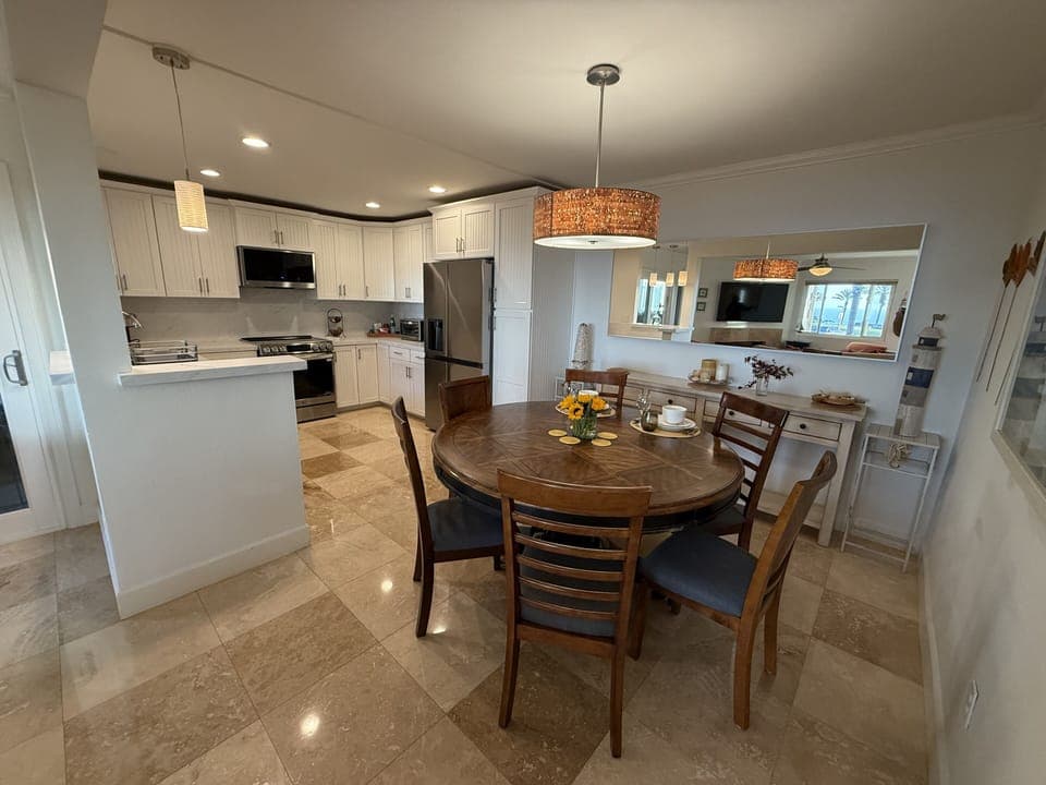 Dining Area with Kitchen behind