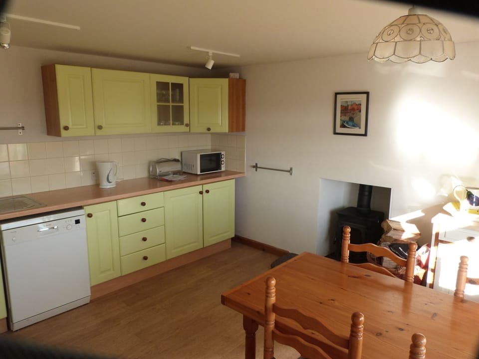 Well equipped kitchen with log burner