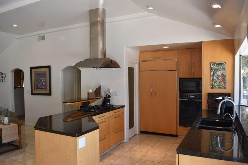 Kitchen with Sub Zero Fridge, 5 Burner Gas Cooktop, Gas Oven, Convection Micro.