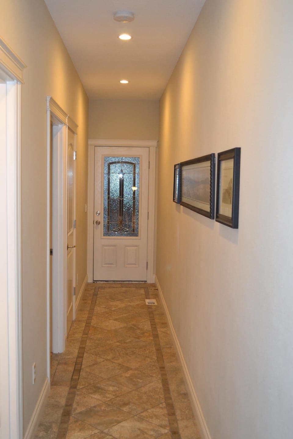 Main level hallway to bathroom, laundry room, master bedroom and rear deck
