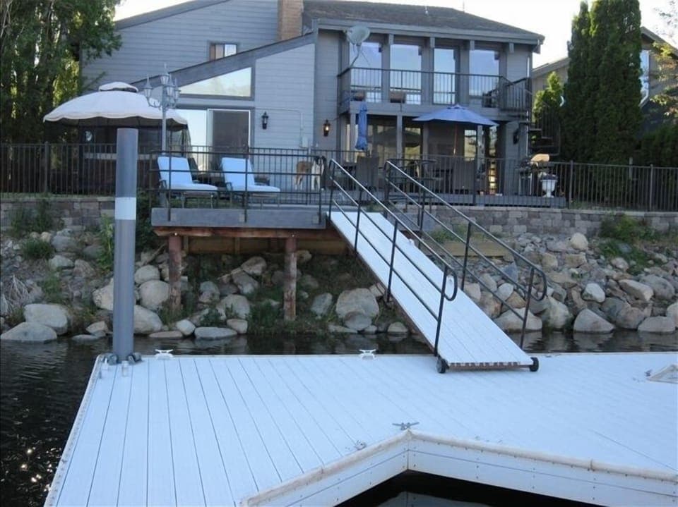 View of rear of home from private boat dock
