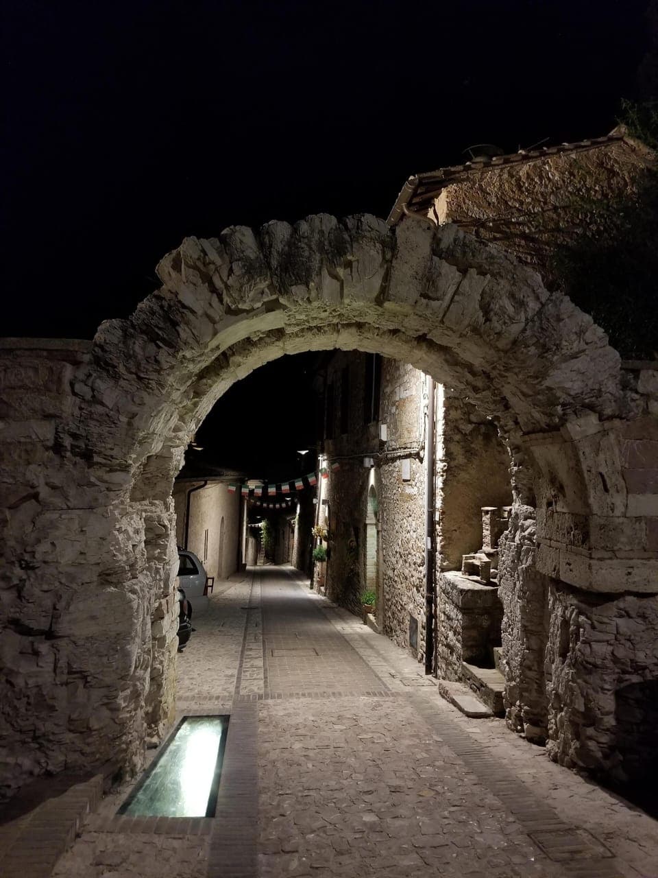 illuminated Spello arch