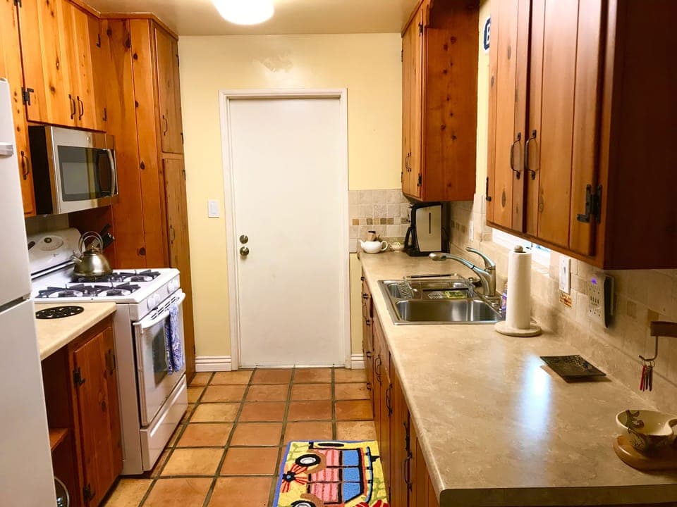 original refinished cabinets from 1957 fully stocked with cooking gear 