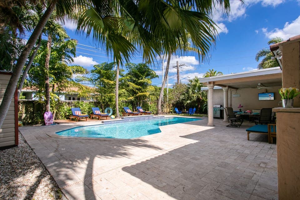Large Heated Salt Water Pool + Private Tropical Backyard + High End Lounge Beds