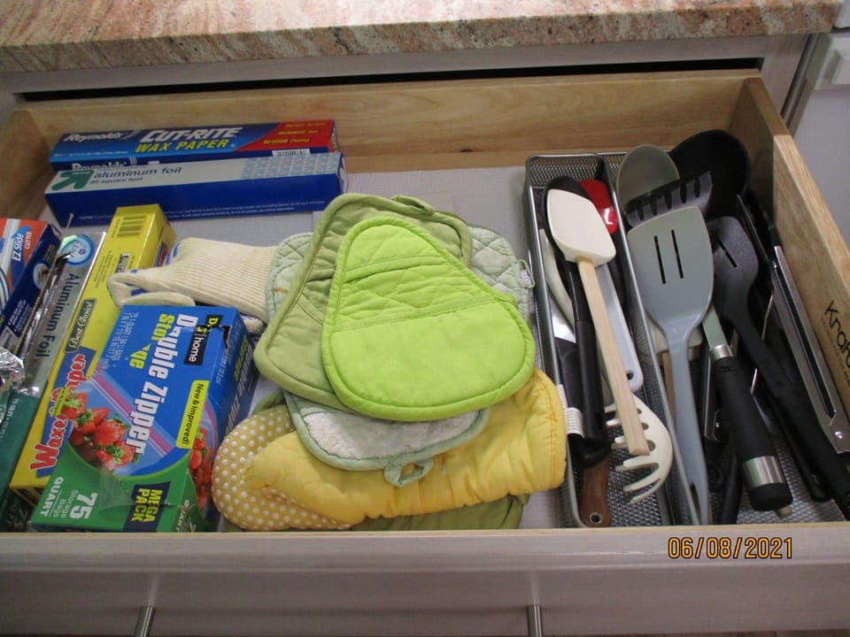 Tongs, spatulas, oven mitts, plastic wrap and foil