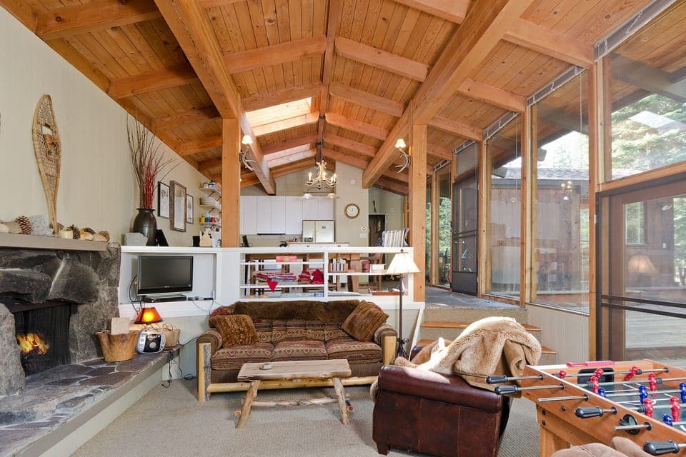 Cozy Great Room with local Mount Pluto volcanic stone fireplace. 3 doors to deck