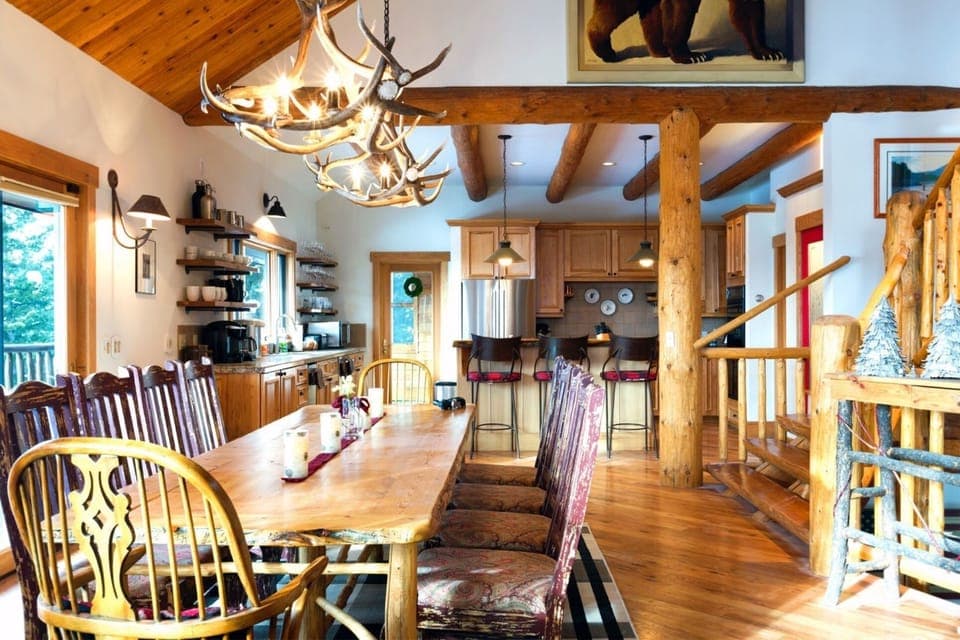 Dining table seats 10-12. The hub of the house. Views of Lone Peak.