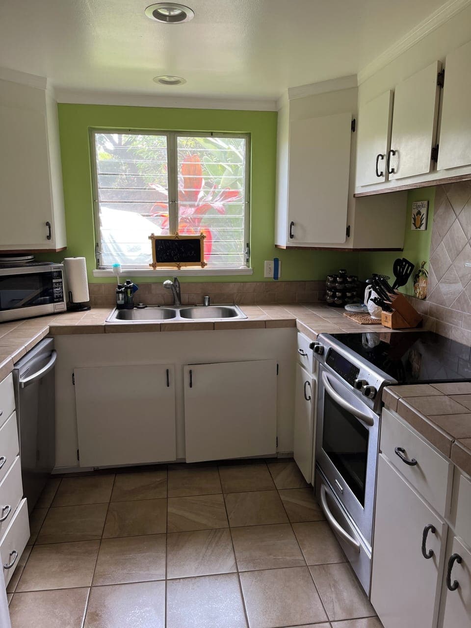 Fully equipped kitchen with stainless steel appliances.