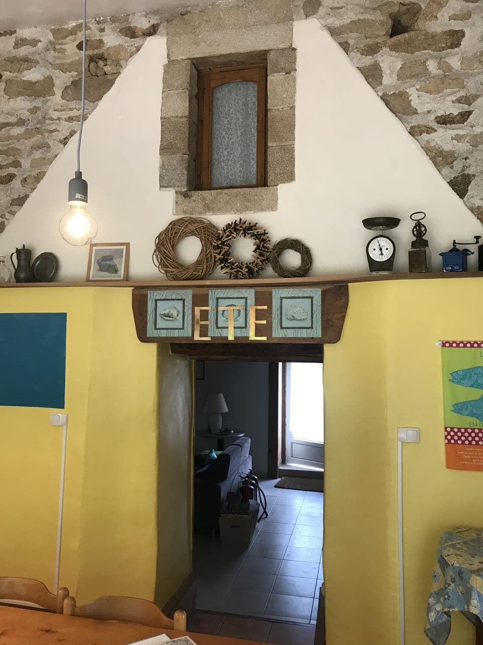 Entry from Kitchen/Dining room to Living room. Kitchen has cathedral ceilings.
