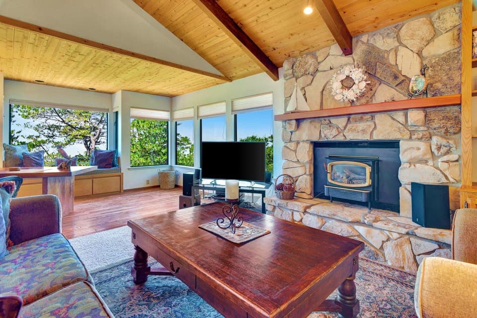 Living Room is spacious w/panoramic views of ocean. F/P is decorative only.