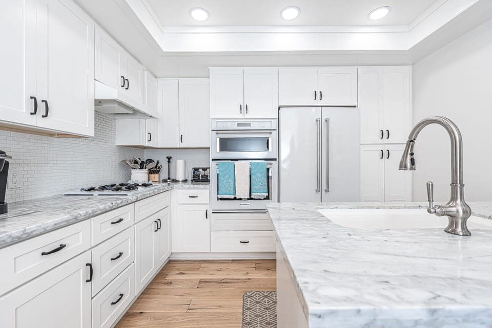 The kitchen comes stocked with dishes, utensils, cookware, bakeware, and small & large appliances.
                