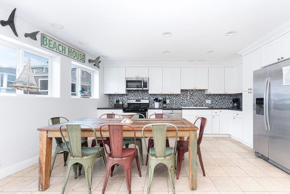 The kitchen comes stocked with dishes, utensils, cookware, bakeware, and all major and small appliances.
                