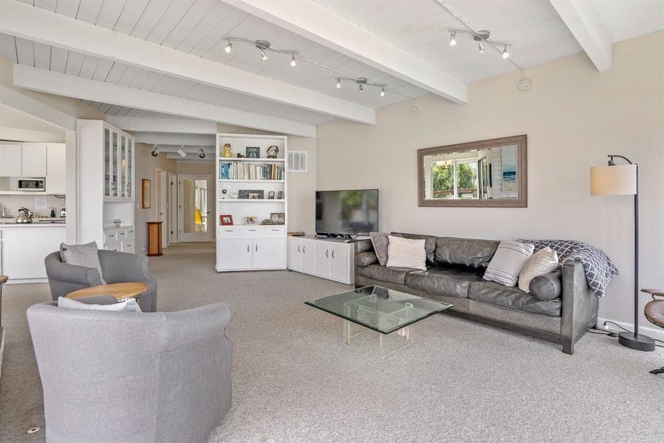 The living room opens to the dining area and kitchen