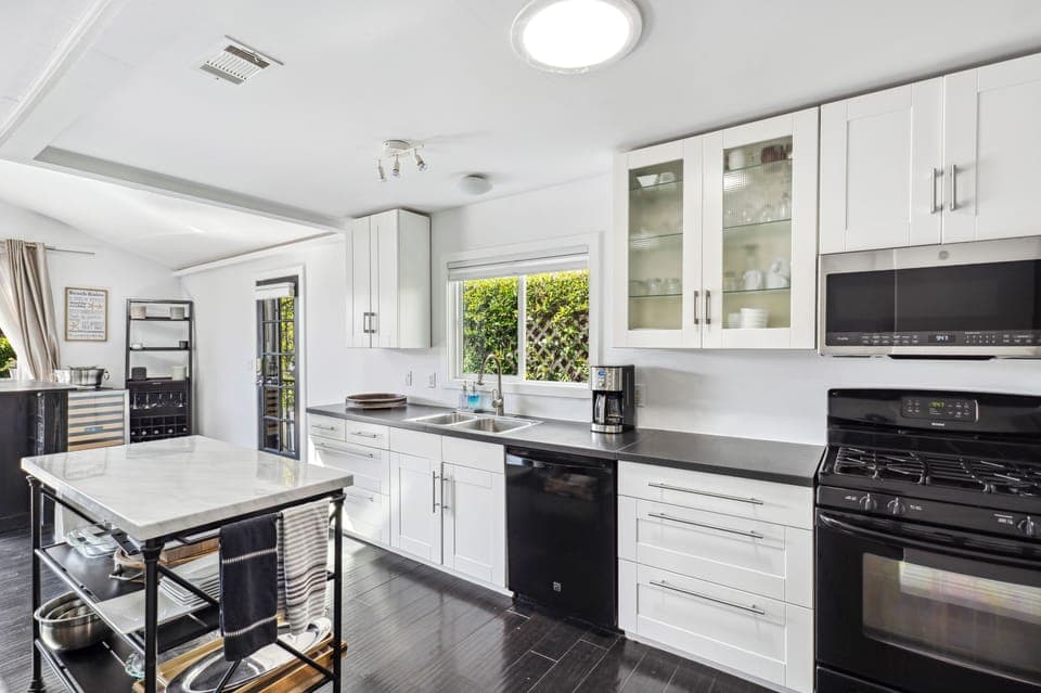 Kitchen in open floor plan. Well appointed with everything for the chef!