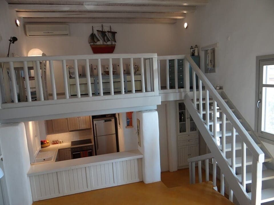 view of loft and kitchen from living room 