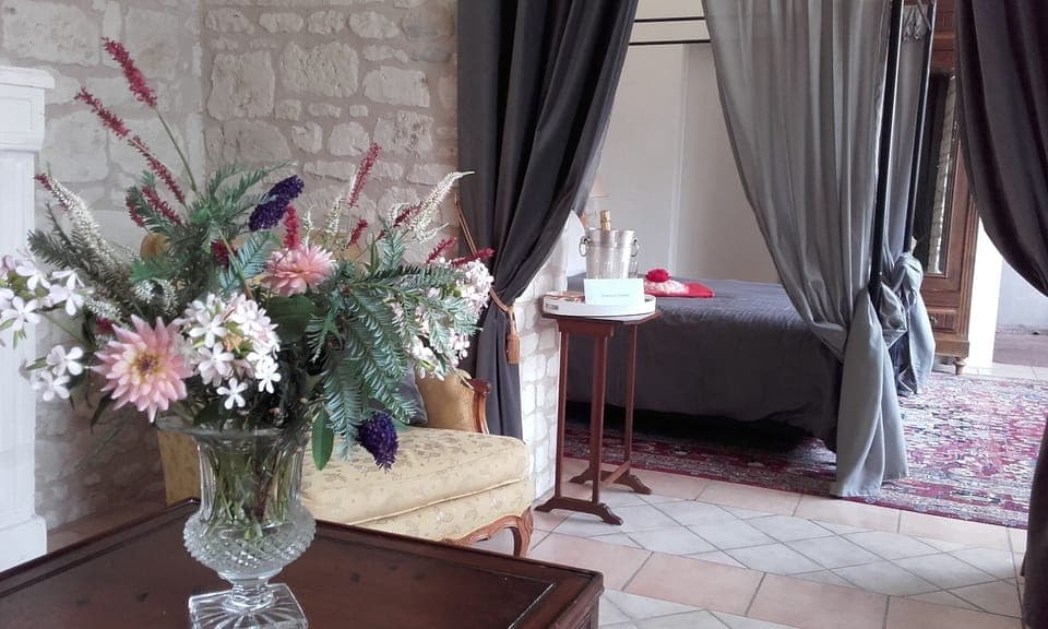 Hydrangea suite with a four poster bed, for a romantic stay.