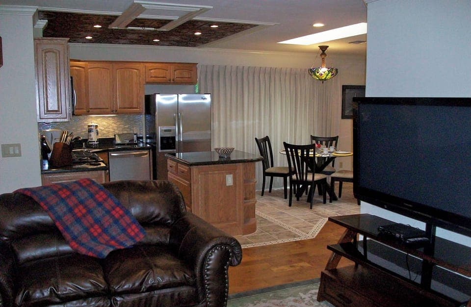 Living room with view of Kitchen and Dining area