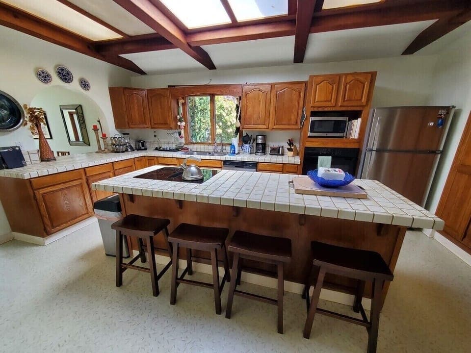 New cooktop and a well equipped kitchen, place settings for 12, serving items. 