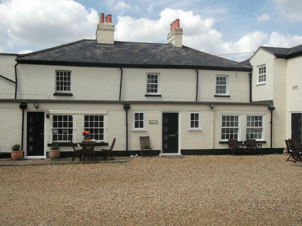 Whitehouse Cottage is to the left of the picture