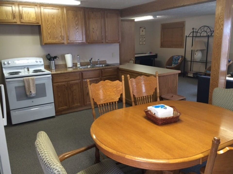 Kitchen/Dining room.  Oak cabinets.  Electric stove, microwave.