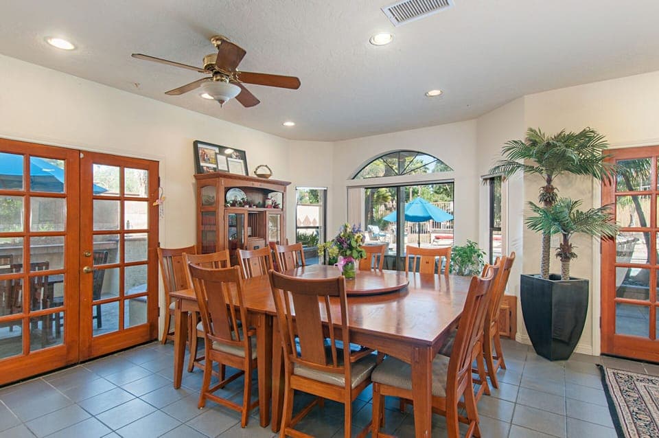 Dining table seats 10 or squeezes 14 hungry souls. A Lazy Susan enhances serving