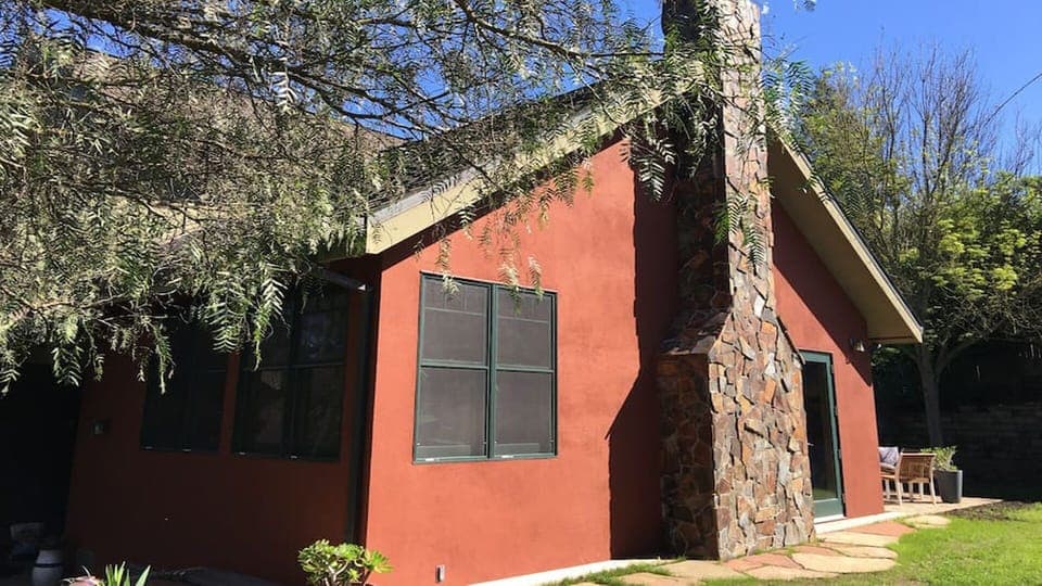  Trees and beautiful flowering shrubs surround the yard making it very private