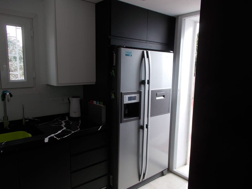 Massive American fridge freezer, with ice maker and filtered drinking water.