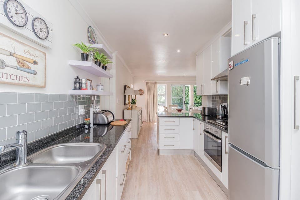 Kitchen leading off private parking area