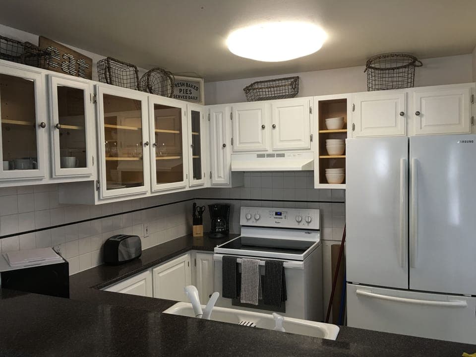 A nicely stocked kitchen.  Blender, microwave, Kuerig, all you would expect