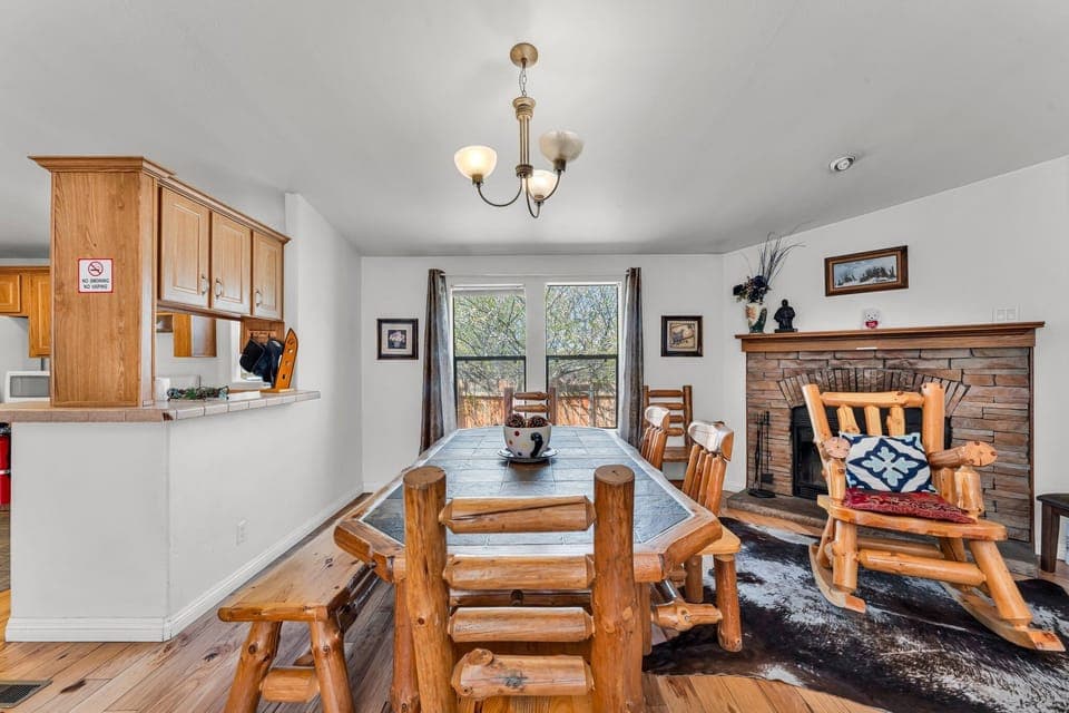 Spacious dining area complemented by a cozy fireplace