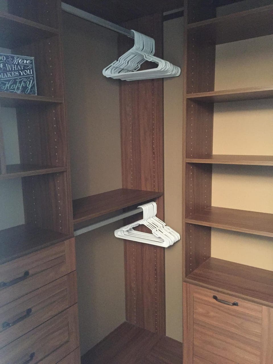 Master bedroom walk-in closet with Calif Closet organizers