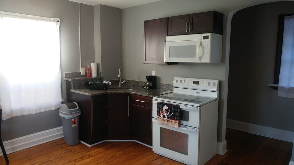 Kitchen with eat in table, deck access, granite counters 