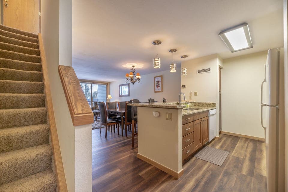 Guests enter the unit on the 1st level (3rd floor). Stairs to 2nd level on left.