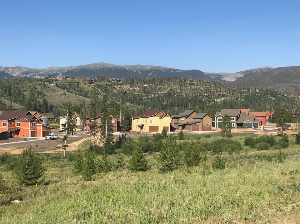 Sunny yellow townhome in a gorgeous location!  Free bus line stops in front!