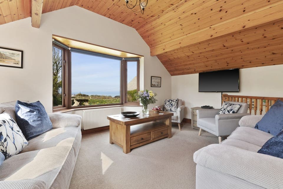 Comfy and cosy sitting room looking over St Brides bay.