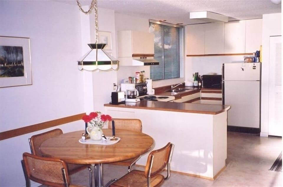 Fully equipped kitchen with everything from wine glasses to can opener.