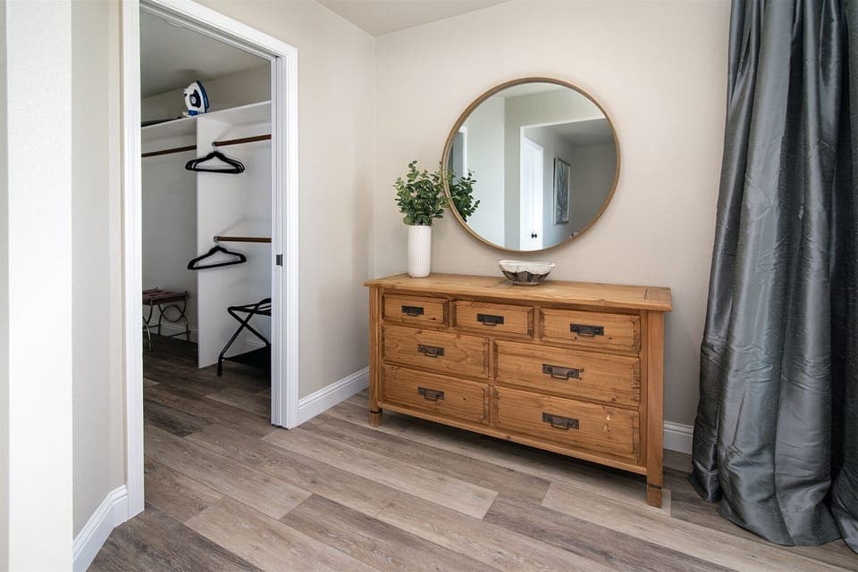 Make yourself at home with this luxurious walk-in closet and dresser in the second bedroom.
