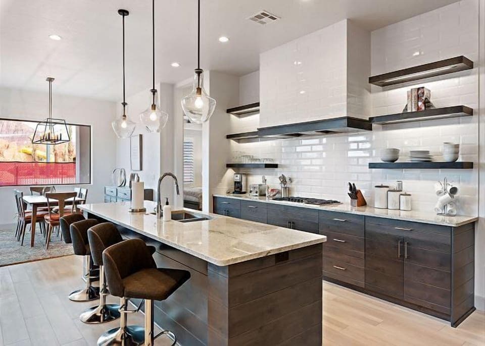 Deluxe kitchen stocked with appliances and cooking utensils