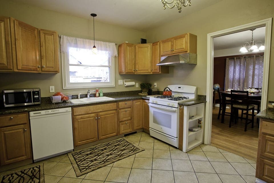 Fully stocked kitchen with gas stove.