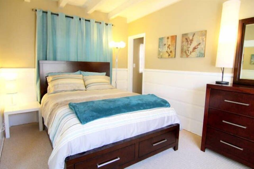 The bedroom, serene and tranquil to help you relax during your stay.