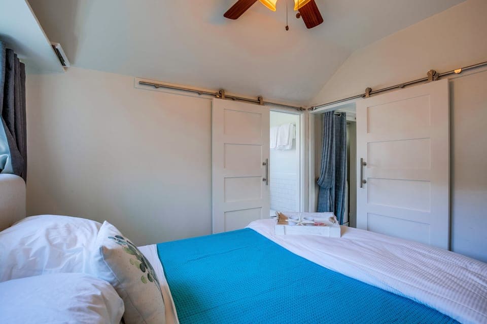 Barn door leading to bathroom.