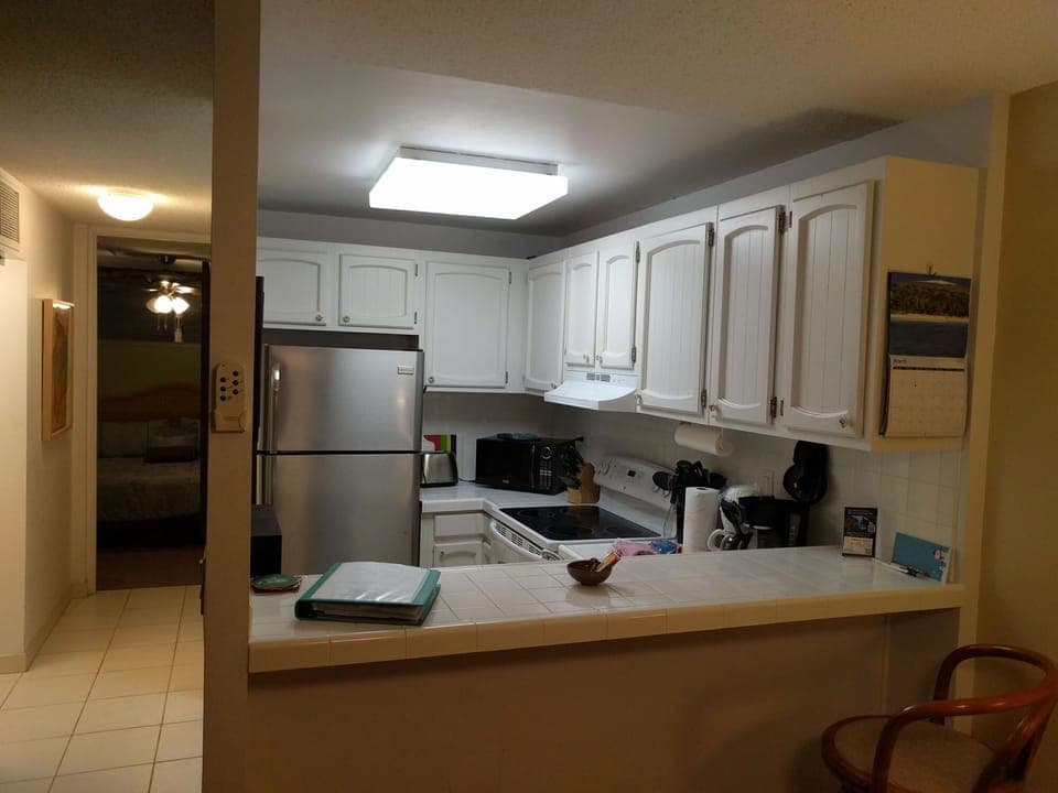 Updated kitchen with stainless fridge and dishwasher.