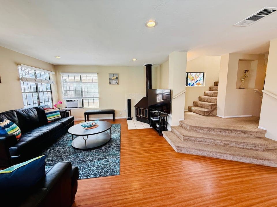 Open floor plan with living, dining and kitchen - window AC in LR